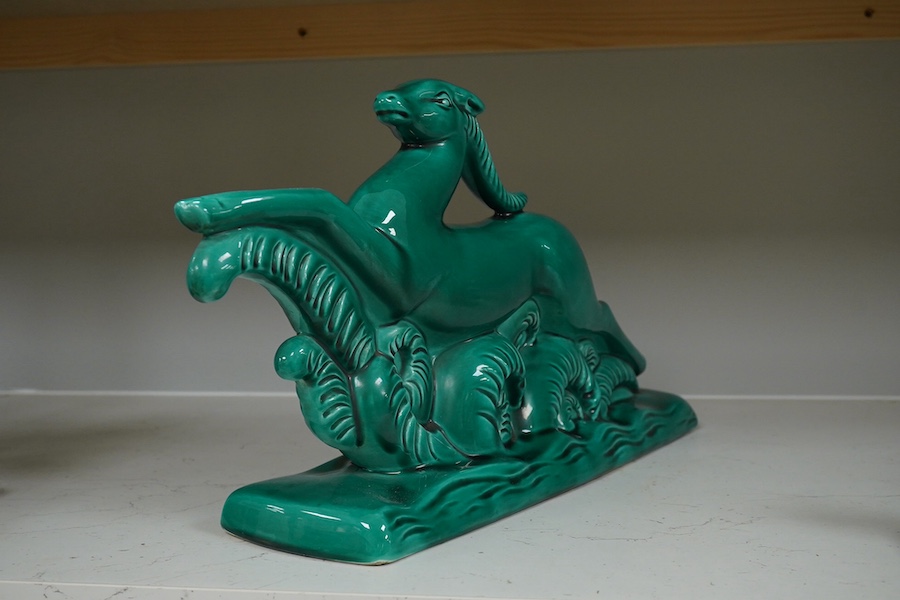 A French Art Deco ceramic antelope with green glaze, 46cm high. Condition - good